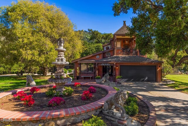 10484 Creek Rd, Oak View, CA 93022 - view of front facade featuring driveway, a garage, a balcony, and roof with shingles