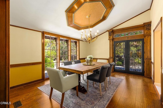 10484 Creek Rd, Oak View, CA 93022 - dining area featuring french doors, a chandelier, hardwood / wood-style floors, lofted ceiling, and ornamental molding