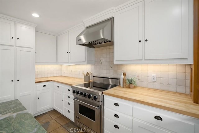2650 Skyview Trl, San Luis Obispo, CA 93405 - kitchen with butcher block countertops, wall chimney range hood, stainless steel range, tasteful backsplash, and white cabinetry