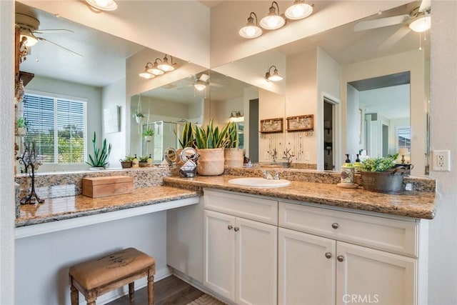 4765 Falconview Ct, Fontana, CA 92336 - bathroom with a ceiling fan, vanity, a shower stall, and wood finished floors