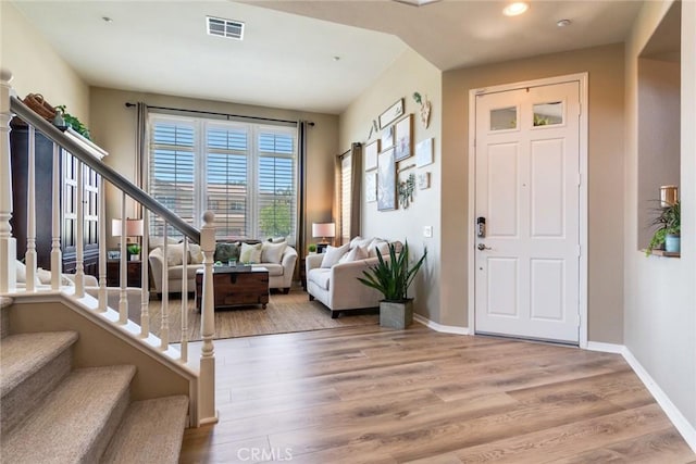 4765 Falconview Ct, Fontana, CA 92336 - foyer featuring stairway, wood finished floors, and recessed lighting