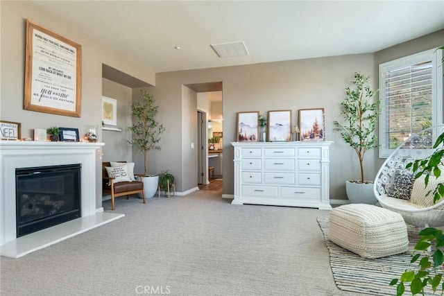 4765 Falconview Ct, Fontana, CA 92336 - sitting room featuring a glass covered fireplace and carpet floors