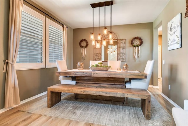 4765 Falconview Ct, Fontana, CA 92336 - dining area with wood finished floors and a chandelier