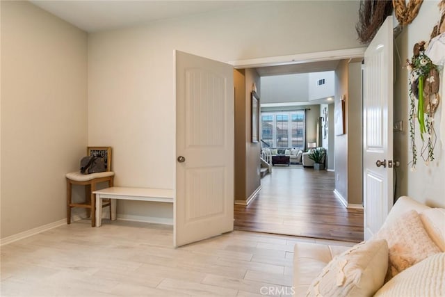 4765 Falconview Ct, Fontana, CA 92336 - hallway with light wood-style floors and baseboards