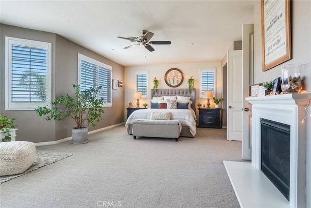 4765 Falconview Ct, Fontana, CA 92336 - bedroom featuring carpet flooring, a glass covered fireplace, and ceiling fan