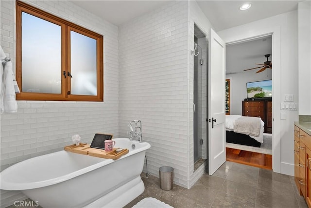 624 6th St, Manhattan Beach, CA 90266 - bathroom with a shower stall, vanity, a freestanding tub, ceiling fan, and ensuite bath