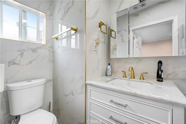 518 Hawthorne St, Glendale, CA 91204 - bathroom featuring tile walls, vanity, toilet, and backsplash
