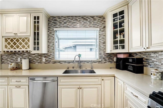 518 Hawthorne St, Glendale, CA 91204 - kitchen with dishwasher, a sink, backsplash, cream cabinetry, and light countertops