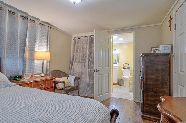 123 N Hayden Dr, Escondido, CA 92027 - bedroom with wood-type flooring, crown molding, and connected bathroom