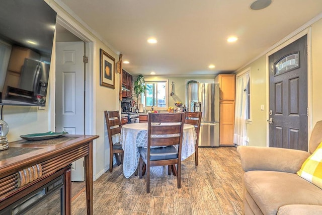 123 N Hayden Dr, Escondido, CA 92027 - dining space with light wood-style floors, recessed lighting, and ornamental molding