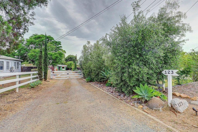 123 N Hayden Dr, Escondido, CA 92027 - view of road featuring a gate and a gated entry