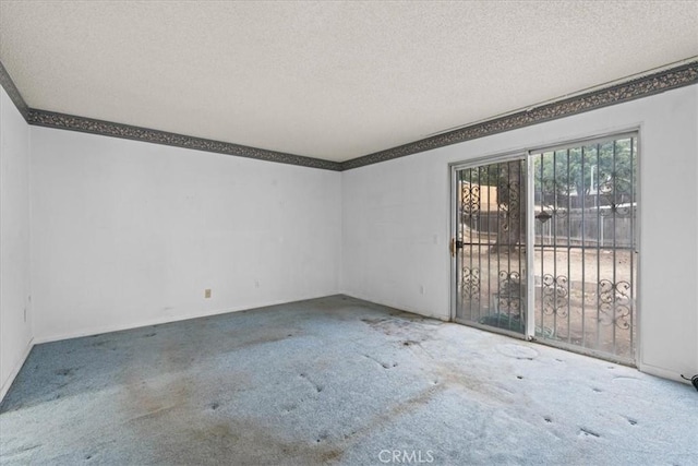 895 Huston Dr, Riverside, CA 92507 - carpeted spare room featuring a textured ceiling and ornamental molding