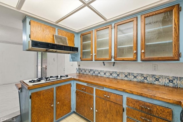 895 Huston Dr, Riverside, CA 92507 - kitchen with glass insert cabinets, white gas cooktop, and brown cabinetry