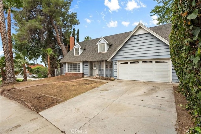 895 Huston Dr, Riverside, CA 92507 - view of front facade with concrete driveway, roof with shingles, a chimney, and a garage