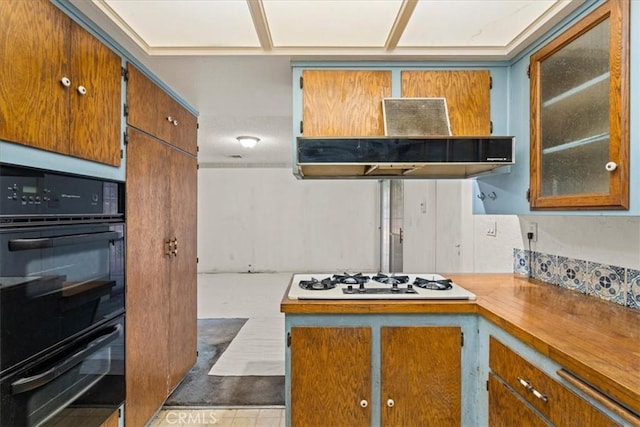 895 Huston Dr, Riverside, CA 92507 - kitchen featuring white gas cooktop, brown cabinets, and glass insert cabinets