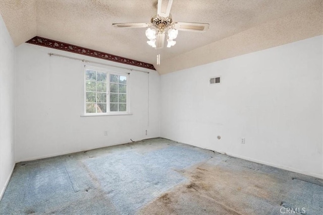 895 Huston Dr, Riverside, CA 92507 - empty room with a textured ceiling, vaulted ceiling, carpet, and ceiling fan