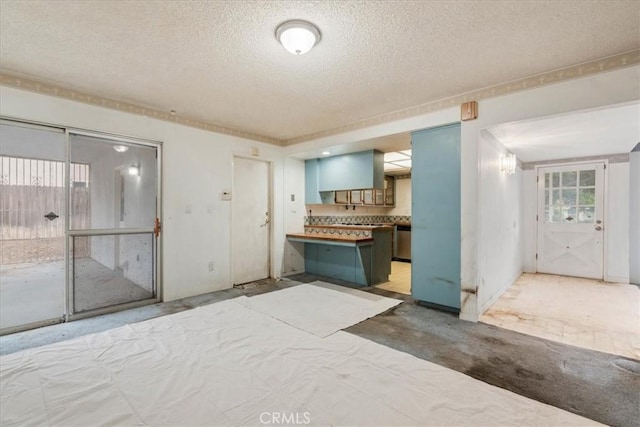 895 Huston Dr, Riverside, CA 92507 - kitchen with a textured ceiling and stainless steel dishwasher