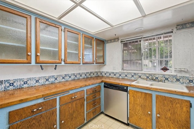 895 Huston Dr, Riverside, CA 92507 - kitchen featuring dishwasher, a sink, glass insert cabinets, and brown cabinetry