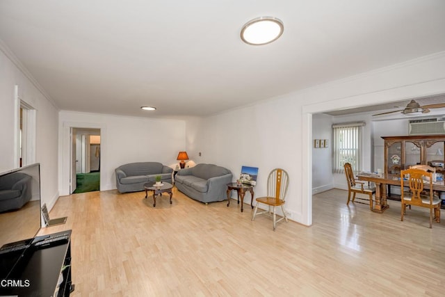 1139 N Heliotrope Dr, Los Angeles, CA 90029 - living room featuring crown molding, light wood-type flooring, and baseboards