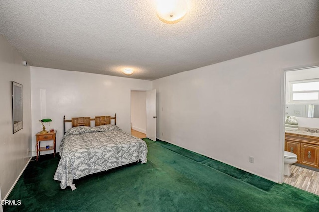1139 N Heliotrope Dr, Los Angeles, CA 90029 - bedroom with carpet flooring, ensuite bathroom, a textured ceiling, and a sink
