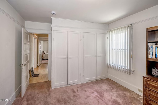 1139 N Heliotrope Dr, Los Angeles, CA 90029 - unfurnished bedroom featuring light carpet and baseboards