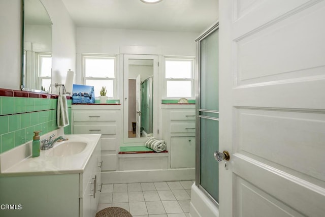 1139 N Heliotrope Dr, Los Angeles, CA 90029 - full bath with tile patterned floors, vanity, and a shower with shower door