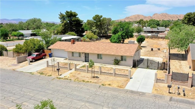 39313 168th St E, Palmdale, CA 93591 - ranch-style house featuring a gate, driveway, a fenced front yard, and a mountain view