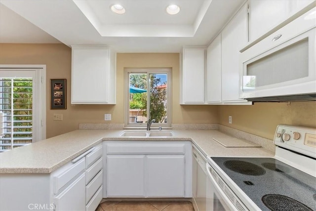 72864 Roy Emerson Ln, Palm Desert, CA 92260 - kitchen with white appliances, a sink, healthy amount of natural light, light countertops, and recessed lighting