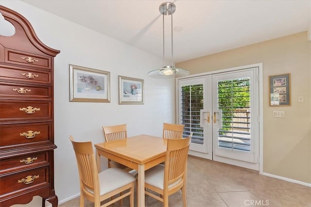 72864 Roy Emerson Ln, Palm Desert, CA 92260 - dining space with french doors, light tile patterned floors, and baseboards