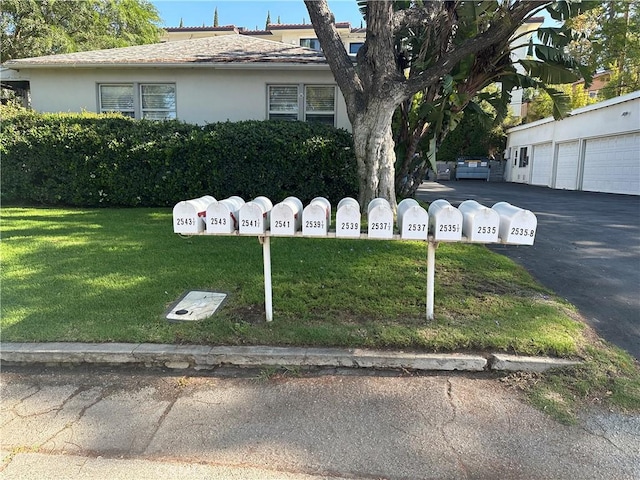 25352543 Cross St, La Crescenta, CA 91214 - view of front facade with stucco siding, a front yard, and community garages