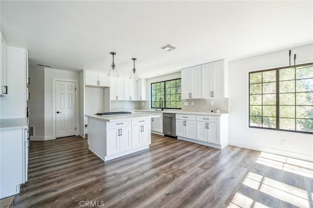 18675 La Ventana Rd, Murrieta, CA 92562 - kitchen with dishwasher, dark wood-style floors, backsplash, and white cabinets