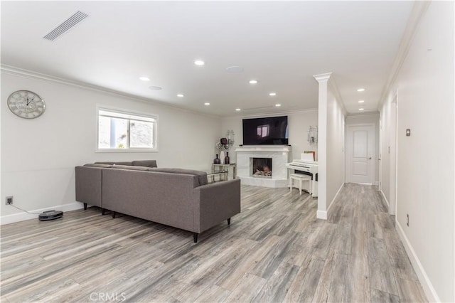 9434 Mclennan Ave, Northridge, CA 91343 - living area featuring ornamental molding, light wood finished floors, a premium fireplace, recessed lighting, and baseboards