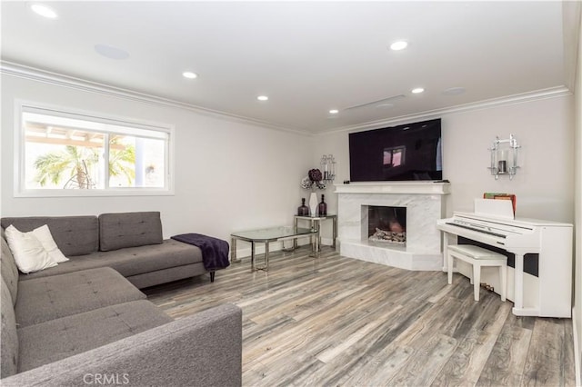 9434 Mclennan Ave, Northridge, CA 91343 - living room featuring ornamental molding, wood finished floors, recessed lighting, and a high end fireplace