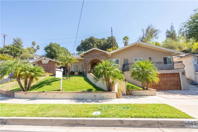 9434 Mclennan Ave, Northridge, CA 91343 - view of front of property featuring concrete driveway, stucco siding, a front yard, an attached garage, and a balcony