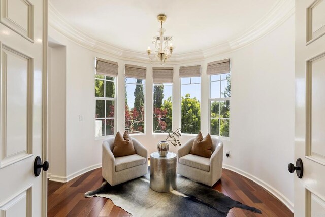 13335 Seagrove St, Carmel Valley, CA 92130 - sitting room featuring crown molding, a chandelier, wood finished floors, and baseboards