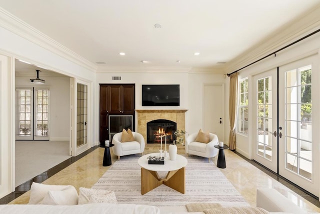 13335 Seagrove St, Carmel Valley, CA 92130 - living area featuring french doors, light marble finish floors, healthy amount of natural light, a tiled fireplace, and crown molding