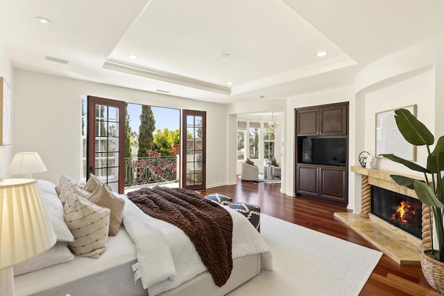 13335 Seagrove St, Carmel Valley, CA 92130 - bedroom with a raised ceiling, access to exterior, a high end fireplace, dark wood finished floors, and recessed lighting
