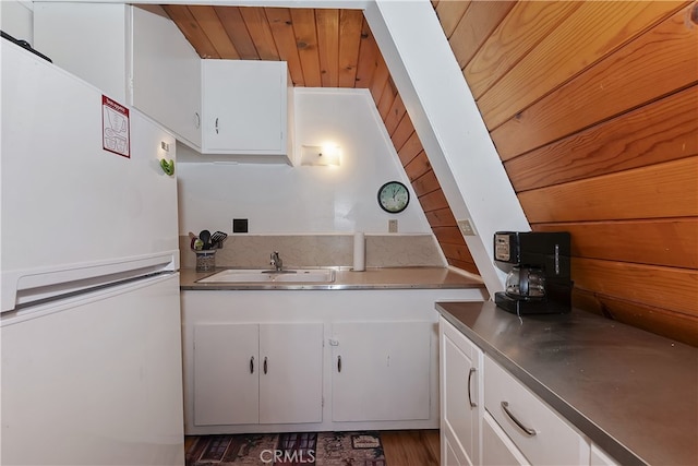 31115 All View Dr, Running Springs, CA 92382 - kitchen with freestanding refrigerator, stainless steel countertops, a sink, white cabinets, and wooden ceiling