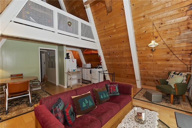31115 All View Dr, Running Springs, CA 92382 - living area with wood finished floors, wooden walls, and a towering ceiling