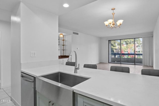 435 La Fayette Park Pl Unit 102, Los Angeles, CA 90057 - kitchen featuring a sink, a chandelier, light countertops, open floor plan, and dishwasher