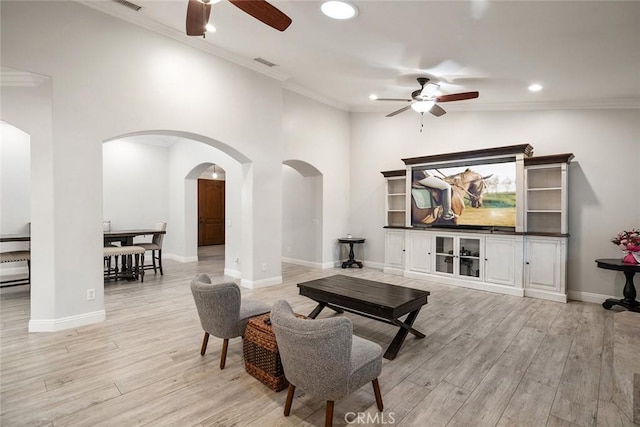 23592 Beech St, Hemet, CA 92545 - living area featuring ceiling fan, arched walkways, recessed lighting, light wood-type flooring, and ornamental molding