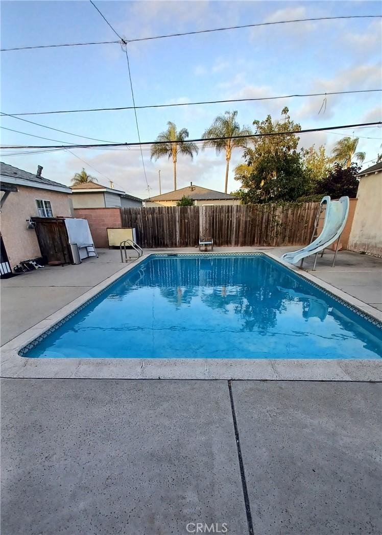 2764 Hayes Ave, Long Beach, CA 90810 - view of pool with a water slide, a patio area, and a diving board