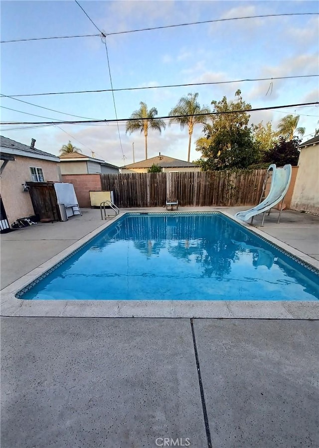 2764 Hayes Ave, Long Beach, CA 90810 - view of pool with a water slide, a patio area, and a diving board