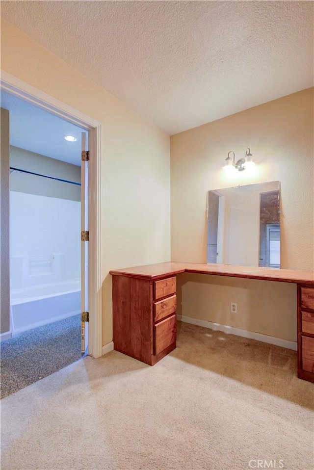 2001 5th St, Atwater, CA 95301 - full bathroom with carpet flooring, a bath, a textured ceiling, vanity, and baseboards
