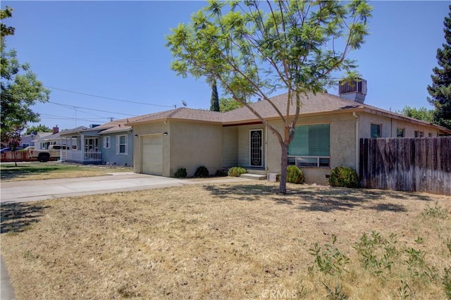 2001 5th St, Atwater, CA 95301 - ranch-style house featuring stucco siding, an attached garage, and concrete driveway