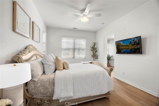 144 Borrego, Irvine, CA 92618 - bedroom with wood finished floors, baseboards, and a ceiling fan