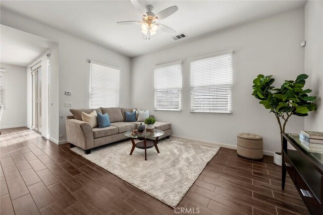 144 Borrego, Irvine, CA 92618 - living area featuring wood finished floors, healthy amount of natural light, a ceiling fan, and baseboards