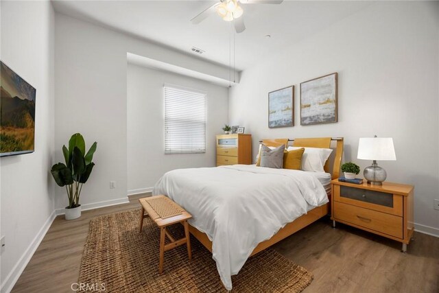 144 Borrego, Irvine, CA 92618 - bedroom with wood finished floors, baseboards, and ceiling fan