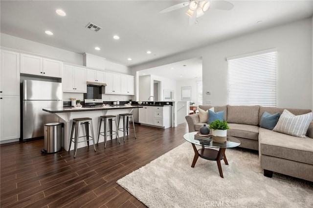 144 Borrego, Irvine, CA 92618 - living room featuring dark wood-type flooring, ceiling fan, and recessed lighting