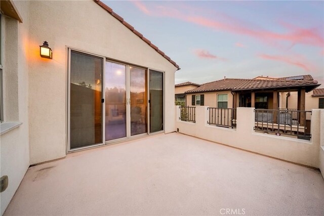 144 Borrego, Irvine, CA 92618 - patio terrace at dusk featuring a patio